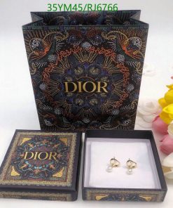 Dior branded jewelry box with earrings and packaging.