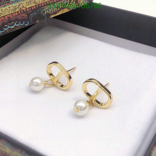 Gold pearl earrings in box