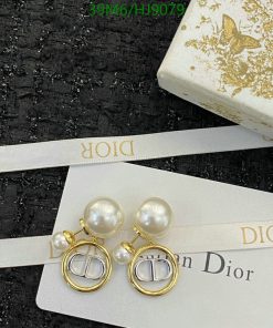 Dior pearl earrings on branded card with box.