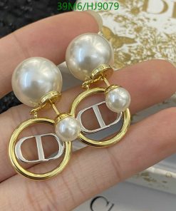 Pearl and gold-tone designer earrings