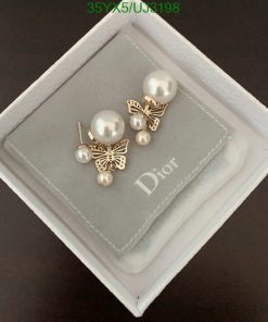 Pearl earrings with butterfly design in box.