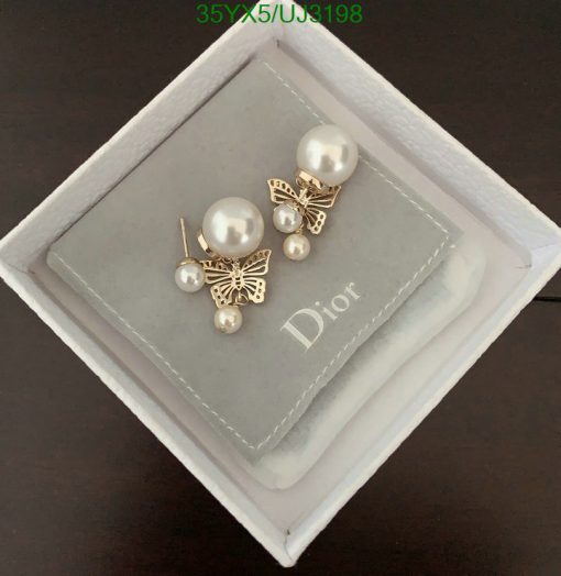 Pearl earrings with butterfly design in box.