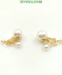 Pearl earrings with gold butterfly details