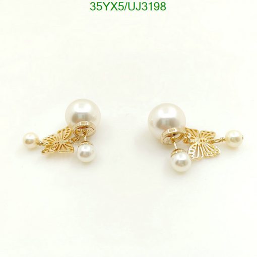 Pearl earrings with gold butterfly details