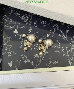 Decorative wall with butterfly and pearl accents.