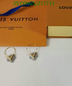 Gold and diamond earrings with Louis Vuitton packaging.