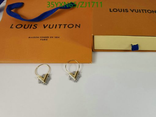 Gold and diamond earrings with Louis Vuitton packaging.