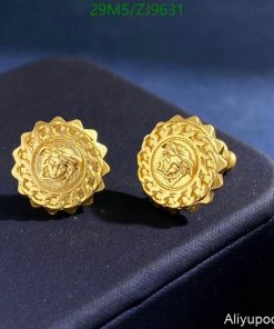 Gold round floral embossed stud earrings.