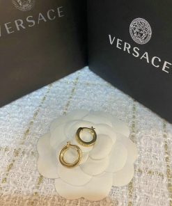 Versace gold hoop earrings with packaging.