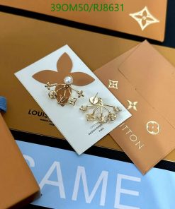 Designer brand earrings on branded packaging.