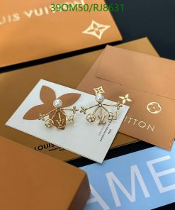 Designer earrings on Louis Vuitton packaging.