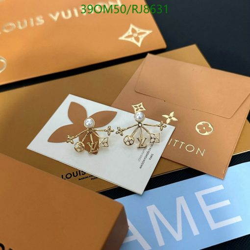 Designer earrings on Louis Vuitton packaging.