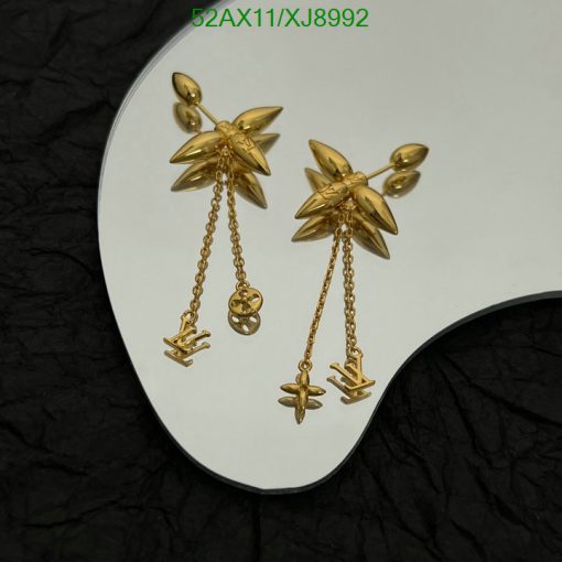 Gold starburst earrings with dangling chain charms.