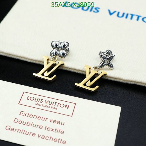 Louis Vuitton flower and logo earrings on display.