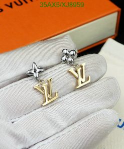 Designer logo earrings on display with box