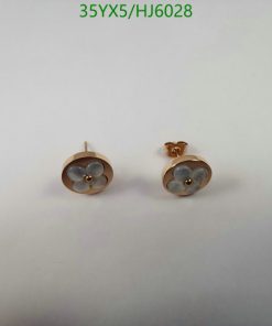 Rose gold flower earrings on white background.