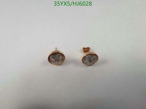 Rose gold flower earrings on white background.