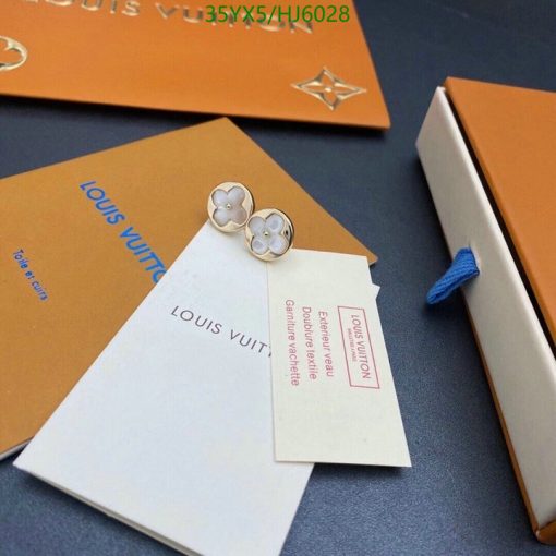 Louis Vuitton packaging and flower-shaped earrings.