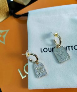 Designer logo earrings with sparkling stones.