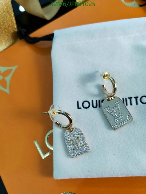 Designer logo earrings with sparkling stones.