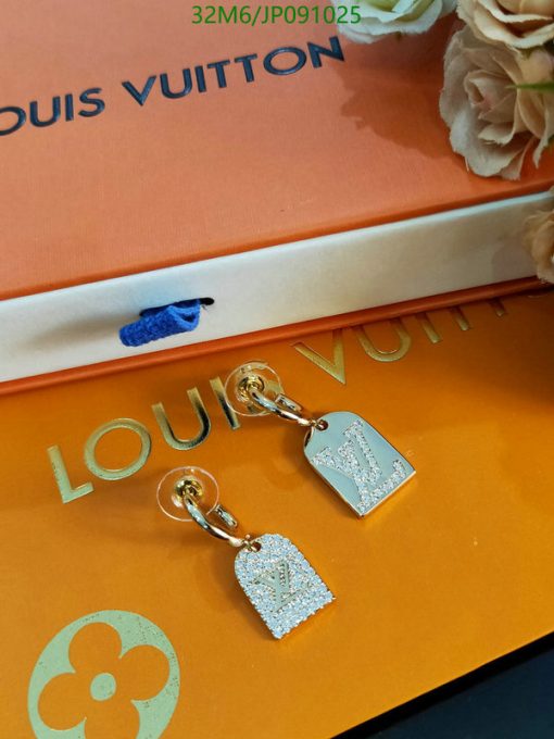 Luxury branded jewelry on orange packaging.