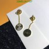 Gold pendant earrings with sparkling details.