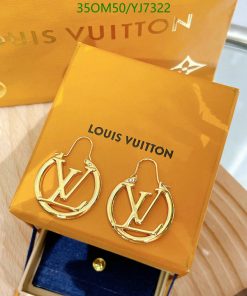 Louis Vuitton branded gold hoop earrings on display.