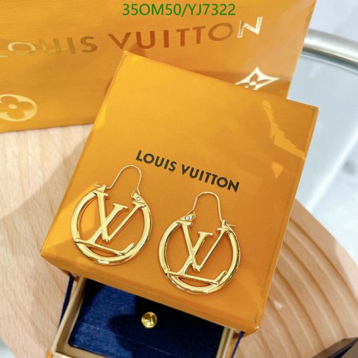 Louis Vuitton branded gold hoop earrings on display.