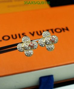 Diamond flower earrings on Louis Vuitton packaging.