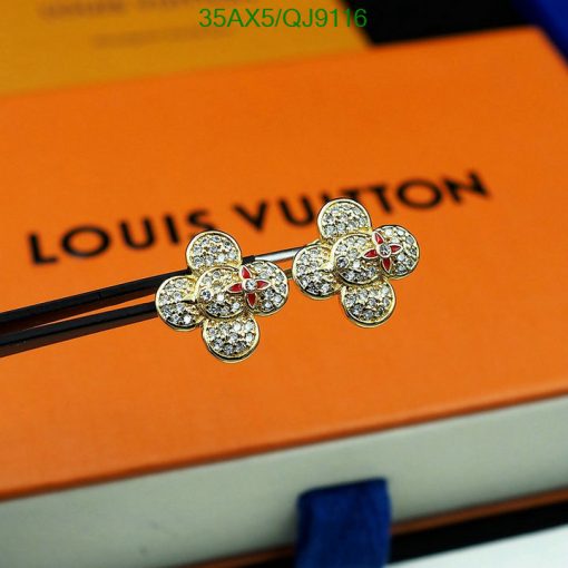 Diamond flower earrings on Louis Vuitton packaging.