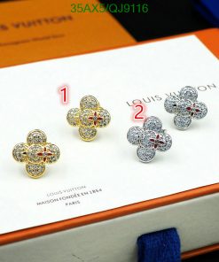 Luxury flower-shaped earrings with gemstones on display.