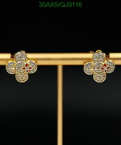 Gold flower-shaped earrings with diamonds.