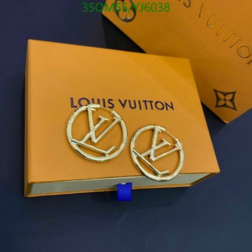 Louis Vuitton earrings on branded box.