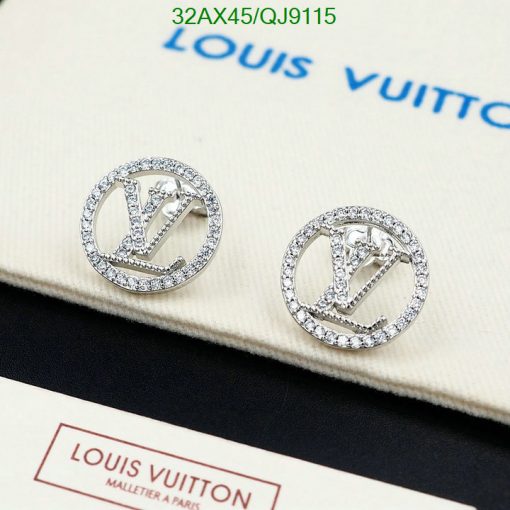 Designer logo earrings with crystals on display.