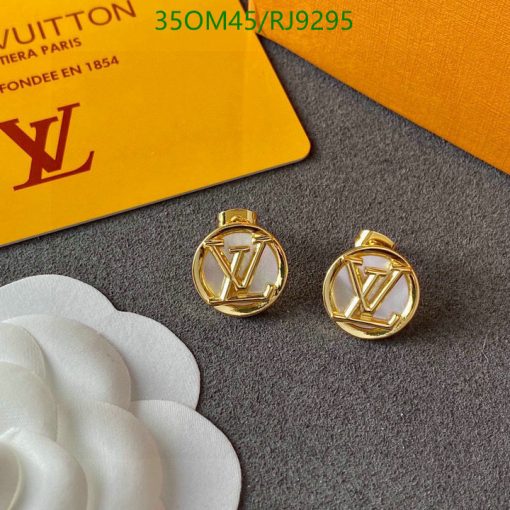 Designer gold-toned logo earrings with packaging.