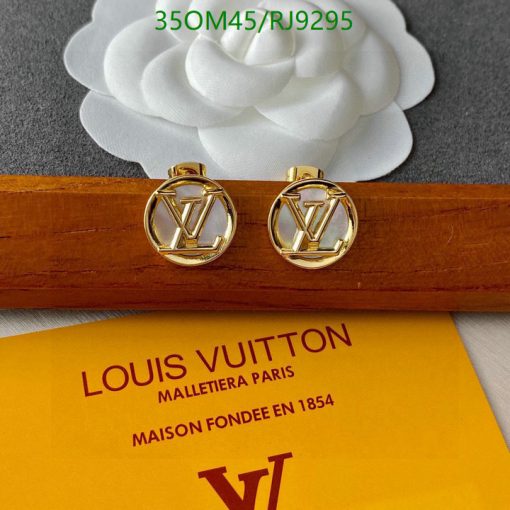 Gold Louis Vuitton cufflinks on branded box.