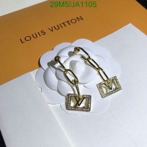 Designer earrings on branded card.