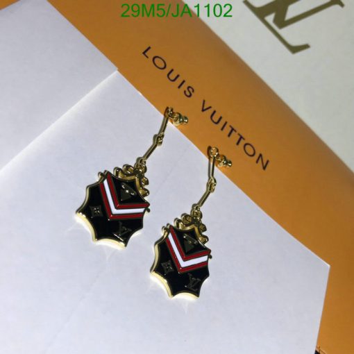 Designer star-shaped drop earrings on branded paper.