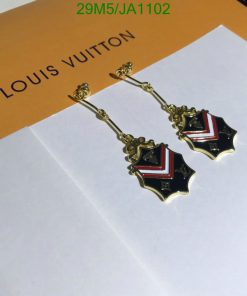 Designer brand dangle earrings on envelope.