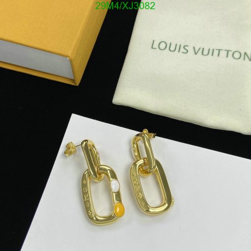 Gold designer chain-link earrings display with packaging.