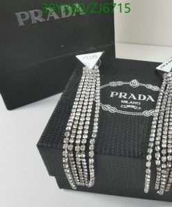 Designer necklace on display with packaging.