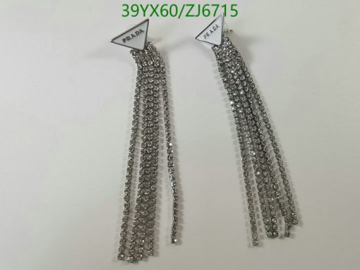 Silver chain fringe earrings with label.