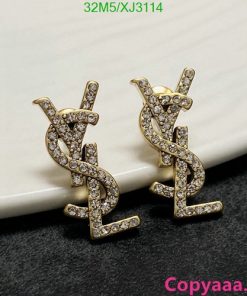 Gold diamond-studded dollar sign earrings.