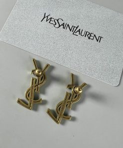 Designer logo earrings on white background.