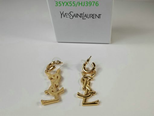 Gold designer logo earrings with packaging.