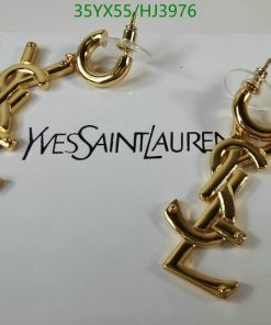 Gold anchor-shaped earrings on branded card.