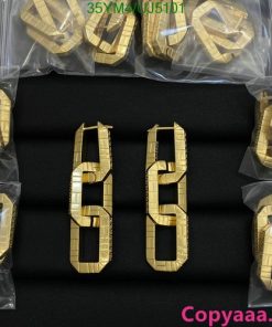 Gold numeral cake decorations on black background.