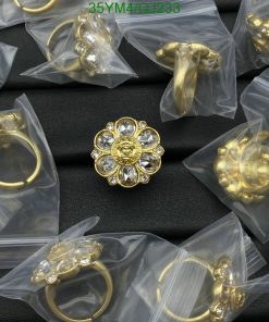 Gold jewelry pieces in transparent packaging.