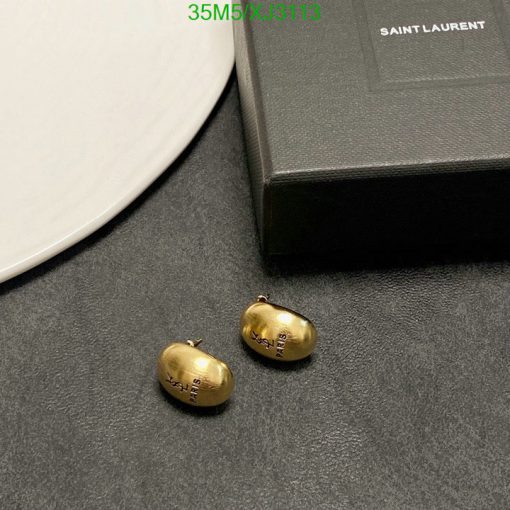 Saint Laurent gold bean earrings and box on table.