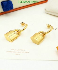 Gold padlock earrings on white display with branding.